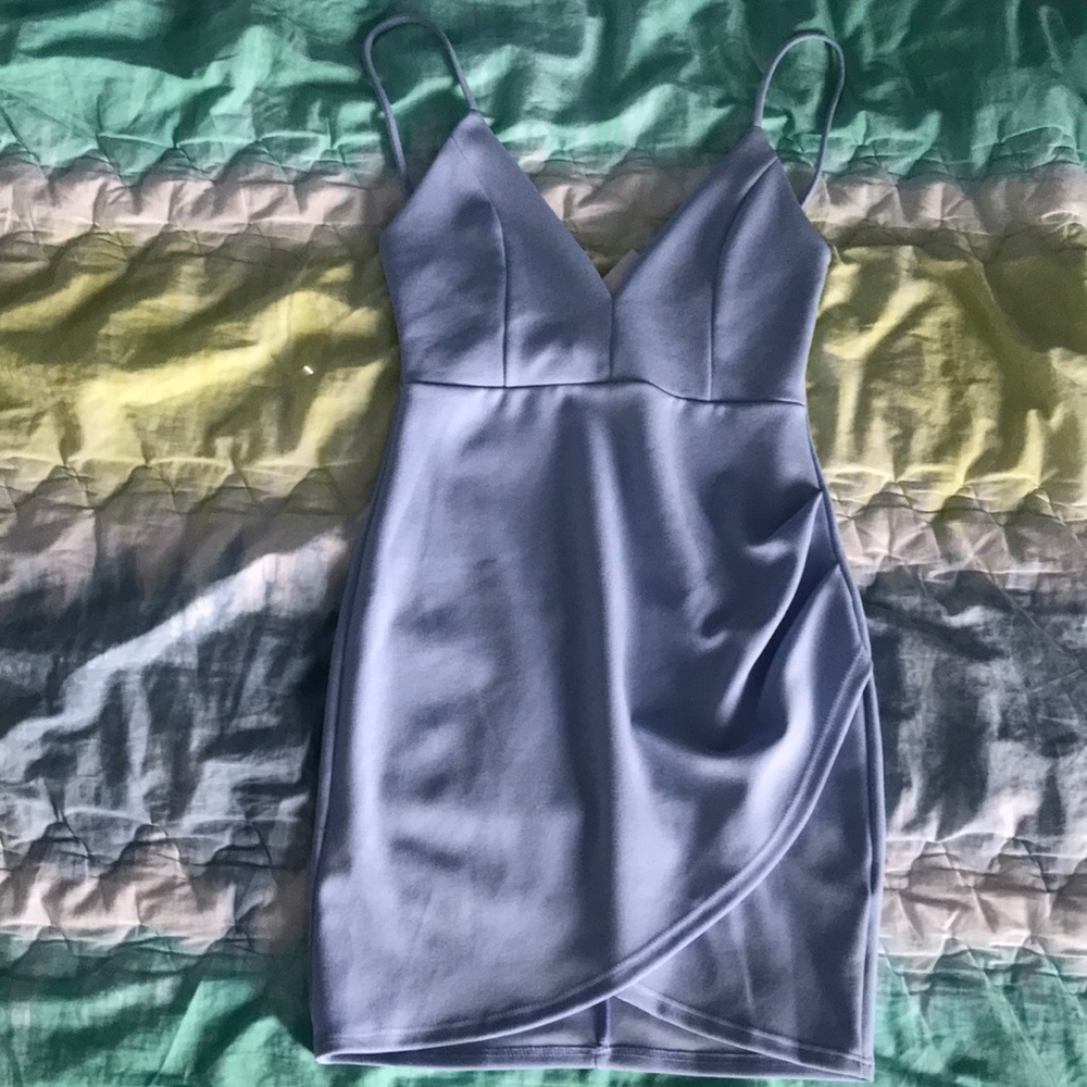 A blue blush boutique wrap front bodycon dress